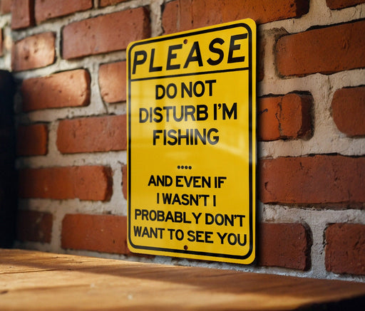 a yellow sign on a brick wall that says please don't disturb im fishing