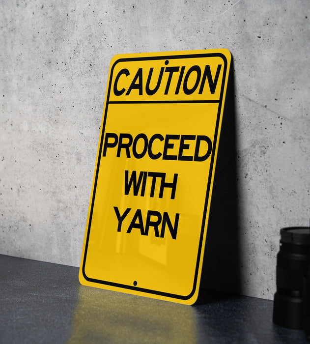 a yellow caution sign sitting on top of a table
