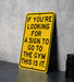 a yellow sign that says if you're looking for a sign to go to