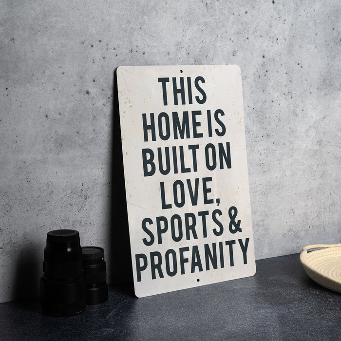 a sign that says this home is built on love sports and propanety