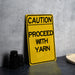 a yellow caution sign sitting on top of a table