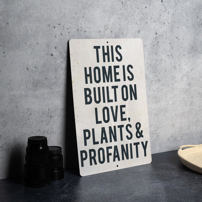 a sign that says this homes built on love plants and propanety