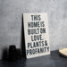 a sign that says this homes built on love plants and propanety