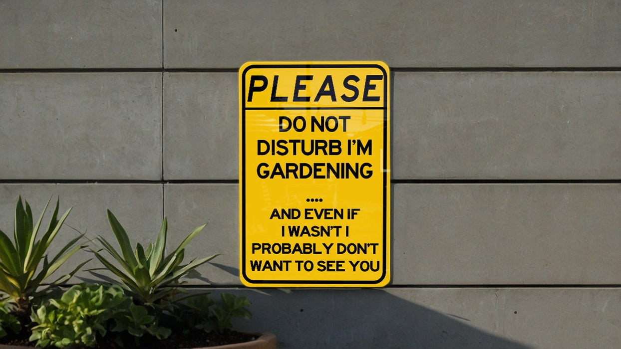 a yellow sign that says please don't disturb i'm gardening