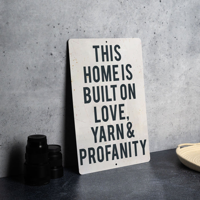a sign that says this homes built on love yarn and propanety