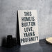 a sign that says this homes built on love yarn and propanety