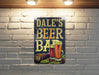 a brick wall with a sign that says dale's beer bar