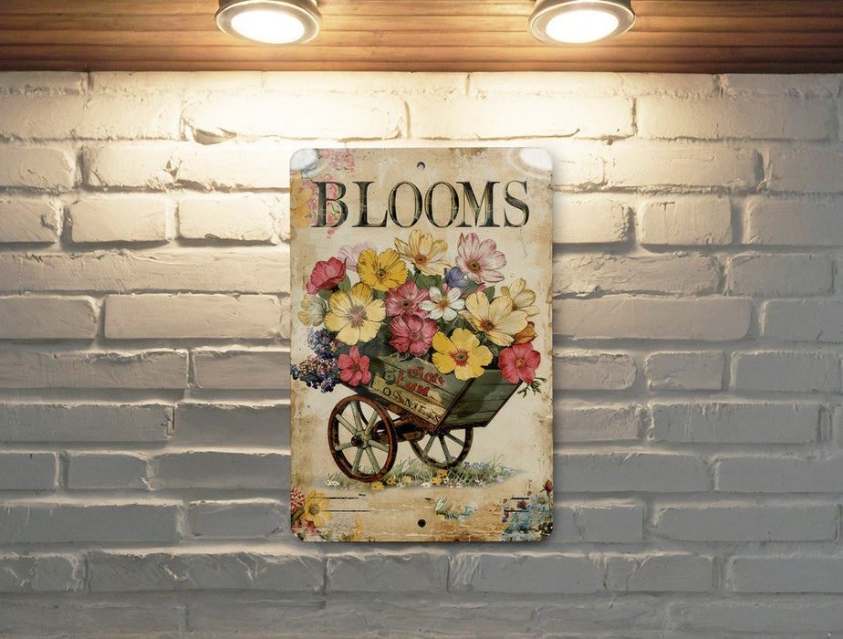 a brick wall with a picture of a wheelbarrow with flowers on it