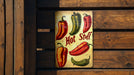 a sign that says hot stuff with peppers on it