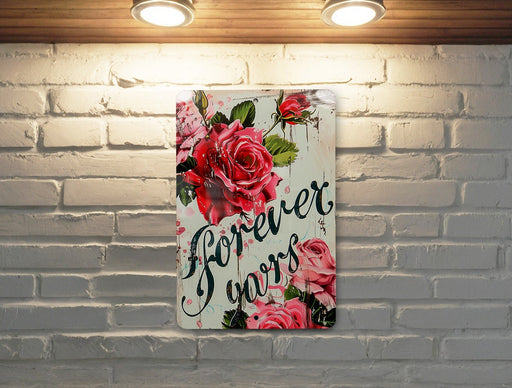 a white brick wall with a painting of roses on it