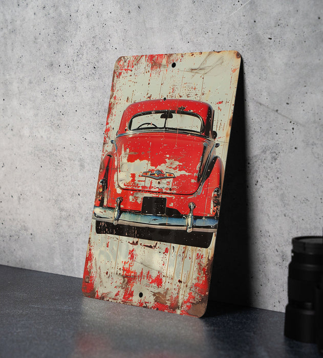 a picture of an old red car on a table