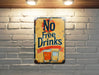 a no free drinks sign on a brick wall