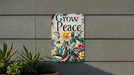 a sign on the side of a building that says grow peace