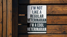a sign on a wooden fence that says i'm not like a regular veteran