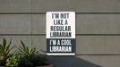 a sign on the side of a building that says i'm not like a