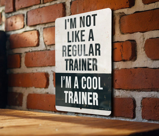 a sign on a brick wall that says i'm not like a regular trainer