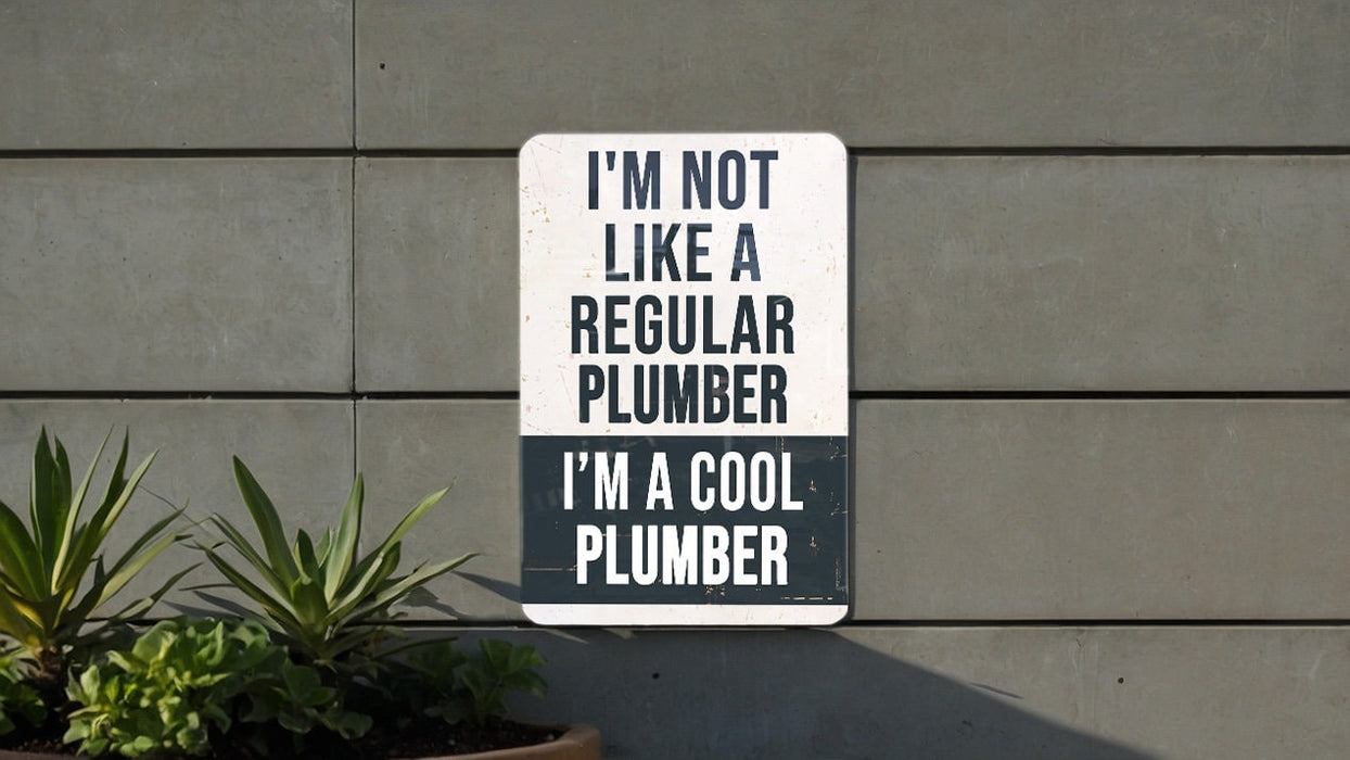 a sign on a wall that says i'm not like a regular plumber