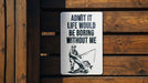 a sign on the side of a wooden fence