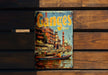 a book sitting on top of a wooden bench