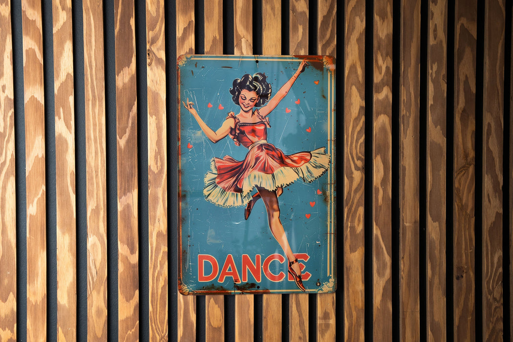 a sign on a wooden wall that says dance