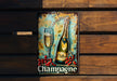a picture of a champagne sign hanging on a wooden wall