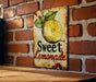 a sign on a brick wall that says sweet lemonade