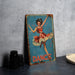 a tin sign with a woman dancing on it