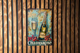 a picture of a champagne sign on a wooden wall