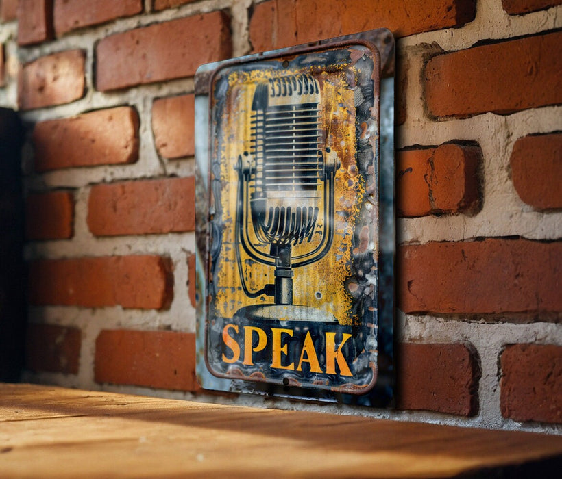 a vintage microphone sign on a brick wall