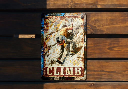 a picture of a man climbing up a mountain
