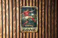 a sign on a wooden wall that says goal zone