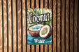a sign on a wooden wall that says coconut water
