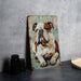 a painting of a bulldog on a wall next to a plate