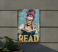 a metal sign with a woman reading a book
