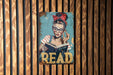 a picture of a woman reading a book