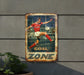 a metal sign with a soccer player kicking a soccer ball