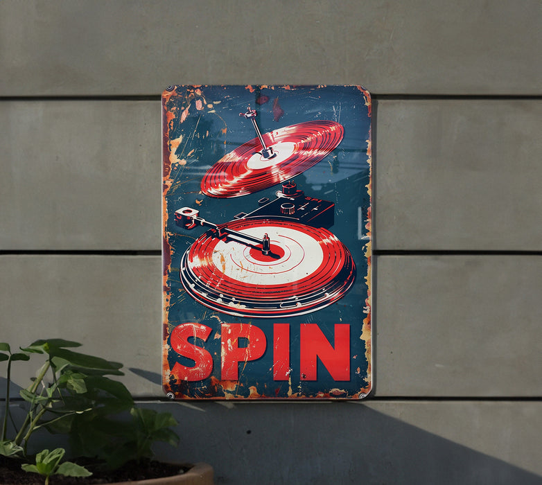 a sign that says spin on it next to a potted plant