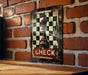 a picture of a chess board on a brick wall