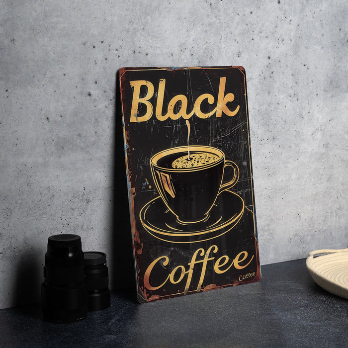 a black coffee sign sitting on top of a table