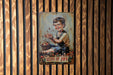 a painting of a young boy holding a flower