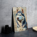 a painting of a dog on a canvas next to a plate
