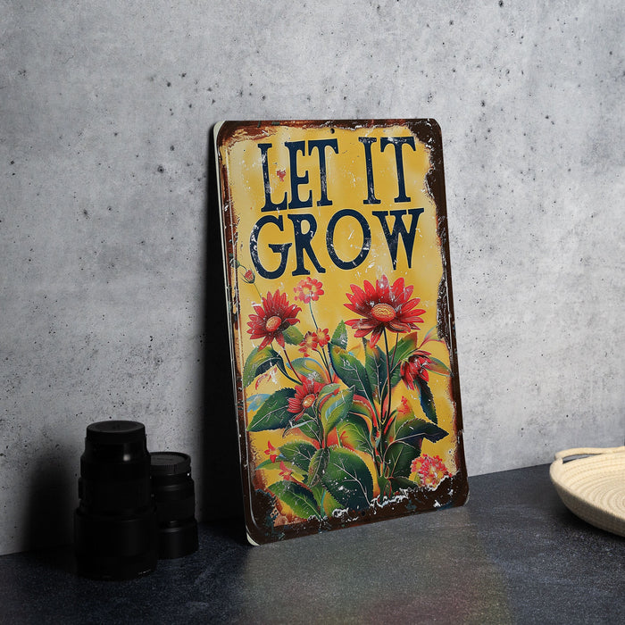 a sign that says let it grow on a table