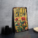 a sign that says let it grow on a table