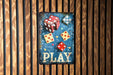 a sign that says play with dices on it