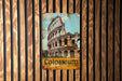 a close up of a sign on a wooden wall