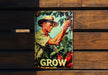 a picture of a man in a hat is hanging on a wooden wall