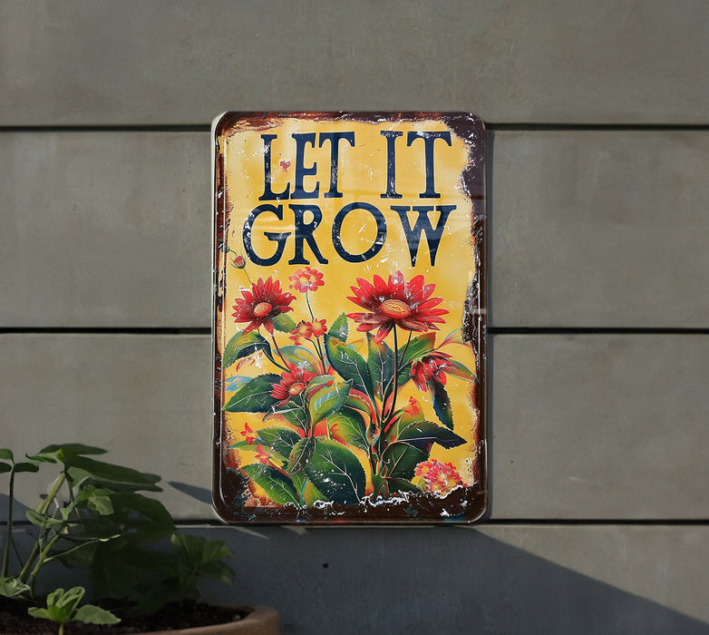 a sign that says let it grow on the side of a building