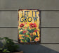 a sign that says let it grow on the side of a building