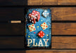 a wooden sign with dices and dices on it