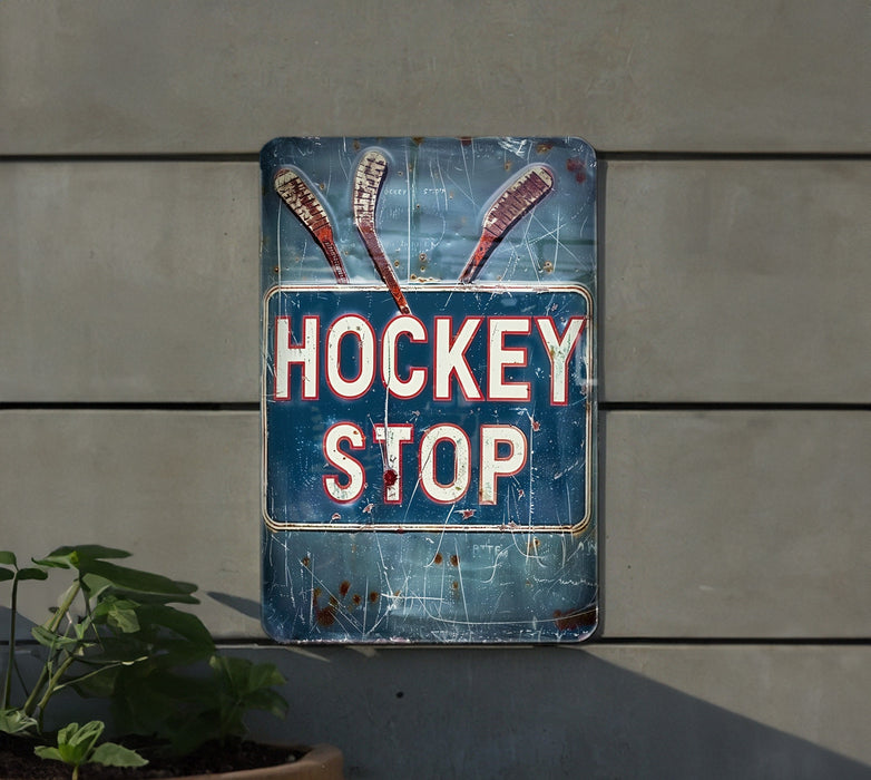 a sign that says hockey stop hanging on the side of a building